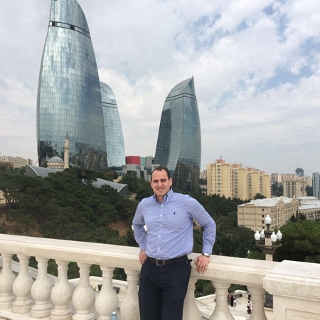 Obada standing in front of the Flame Towers in Baku, Azerbaijan. 