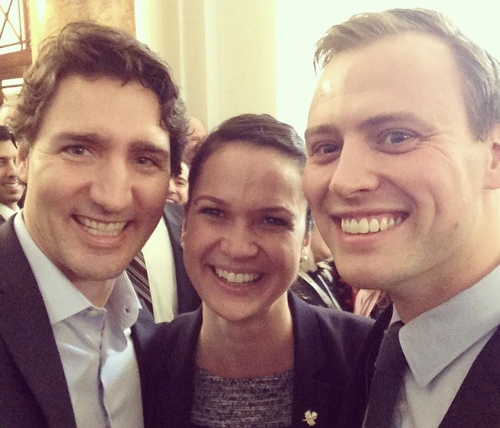 Nadine (center) with Canadian Prime Minister Justin Trudeau (L) at Canada House in November 2015.