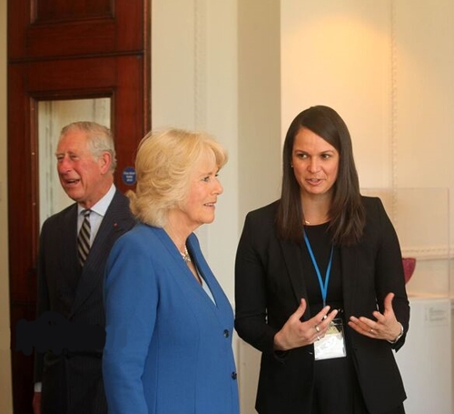 Nadine (R) with Charles, Prince of Wales (L) and Camilla, Duchess of Cornwall (center) during their visit to Canada House in May 2016.