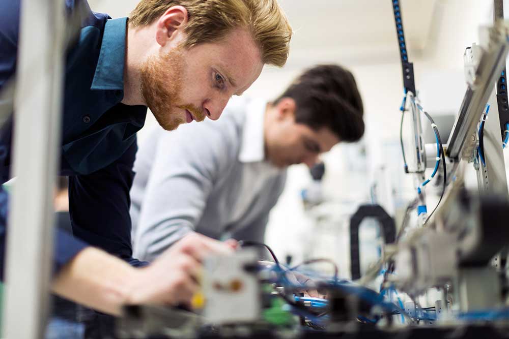 engineers working on machines