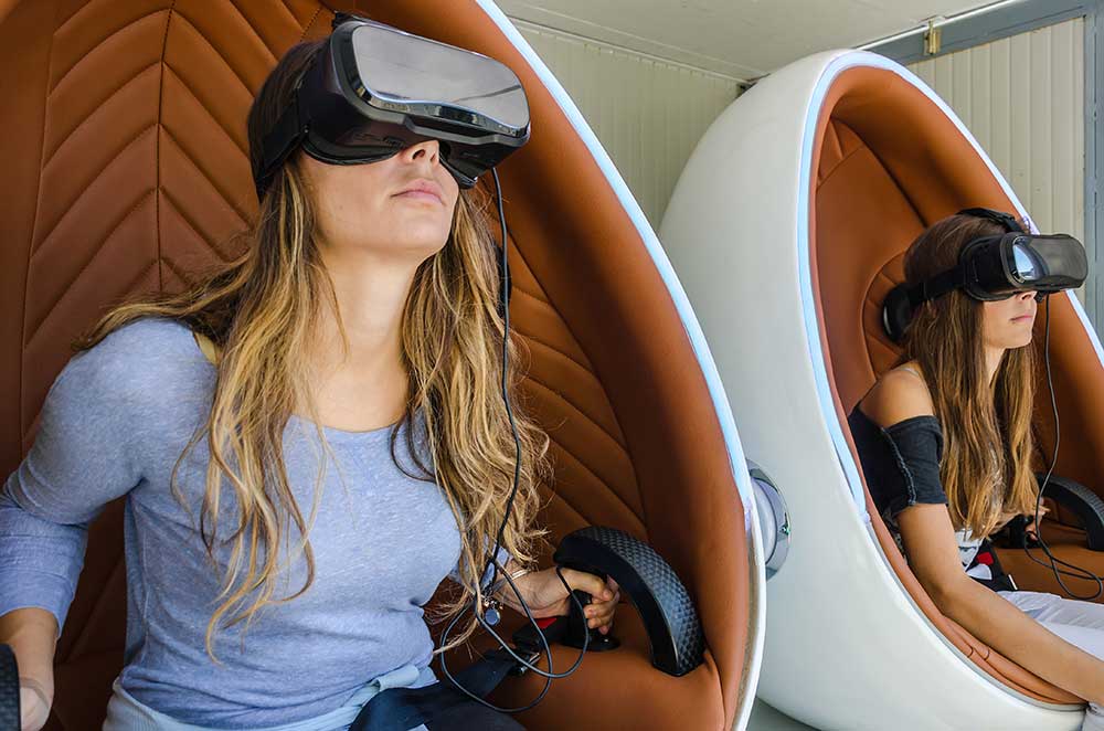 women with VR headsets on