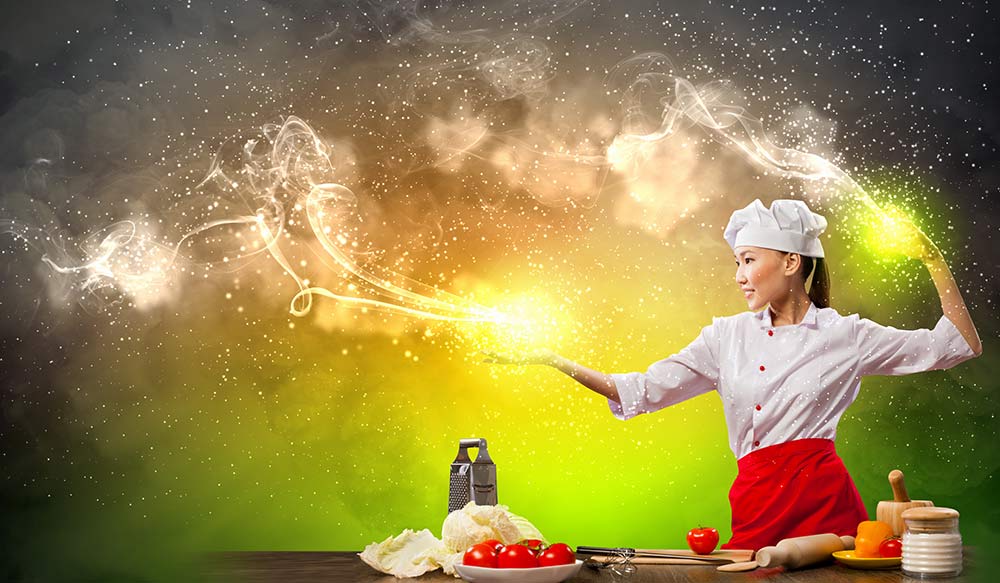 Female chef cooking with magic