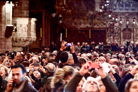 Crowd of people all using their sell phones