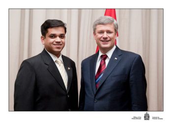 Varun Anthony standing with Prime Minister Stephen Harper