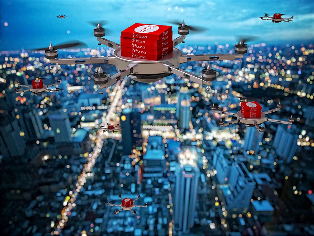 drones delivering pizzas in city sky