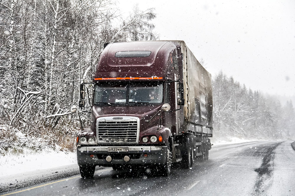 transport truck on snowy highway