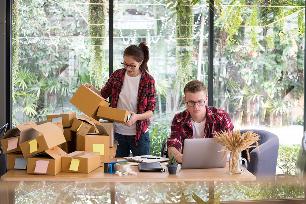 two young entrepreneurs preparing their products for delivery