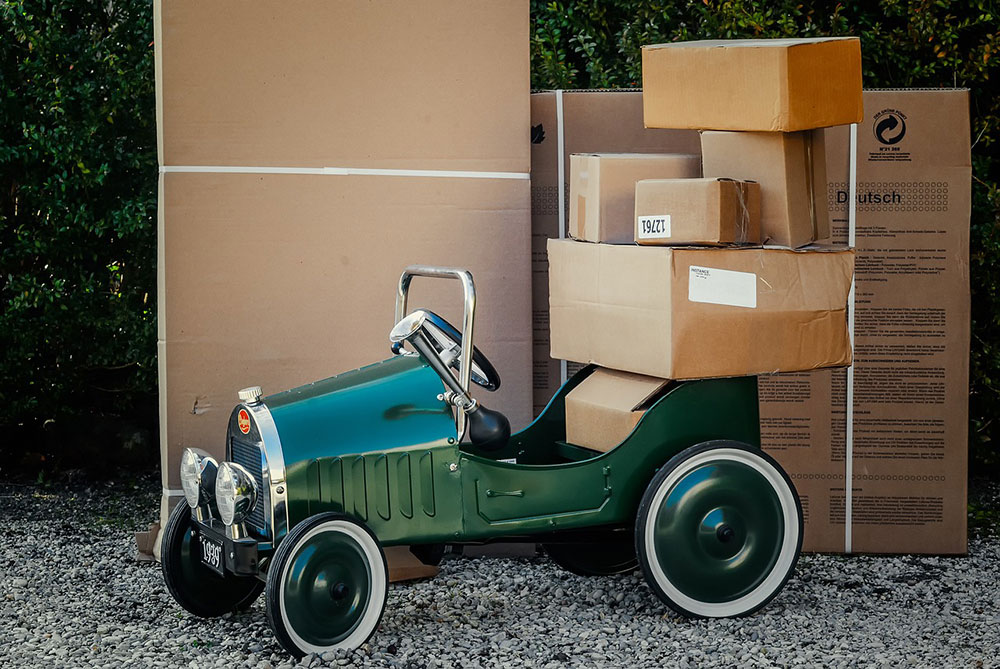 Packages piled on a green jalopy