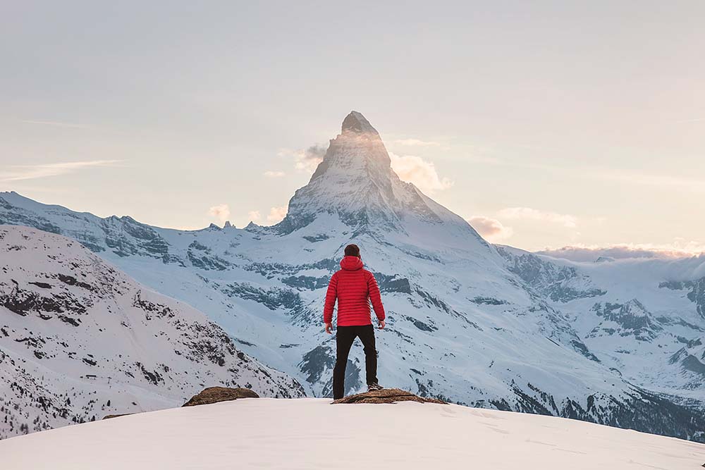 Man standing on mountain peak