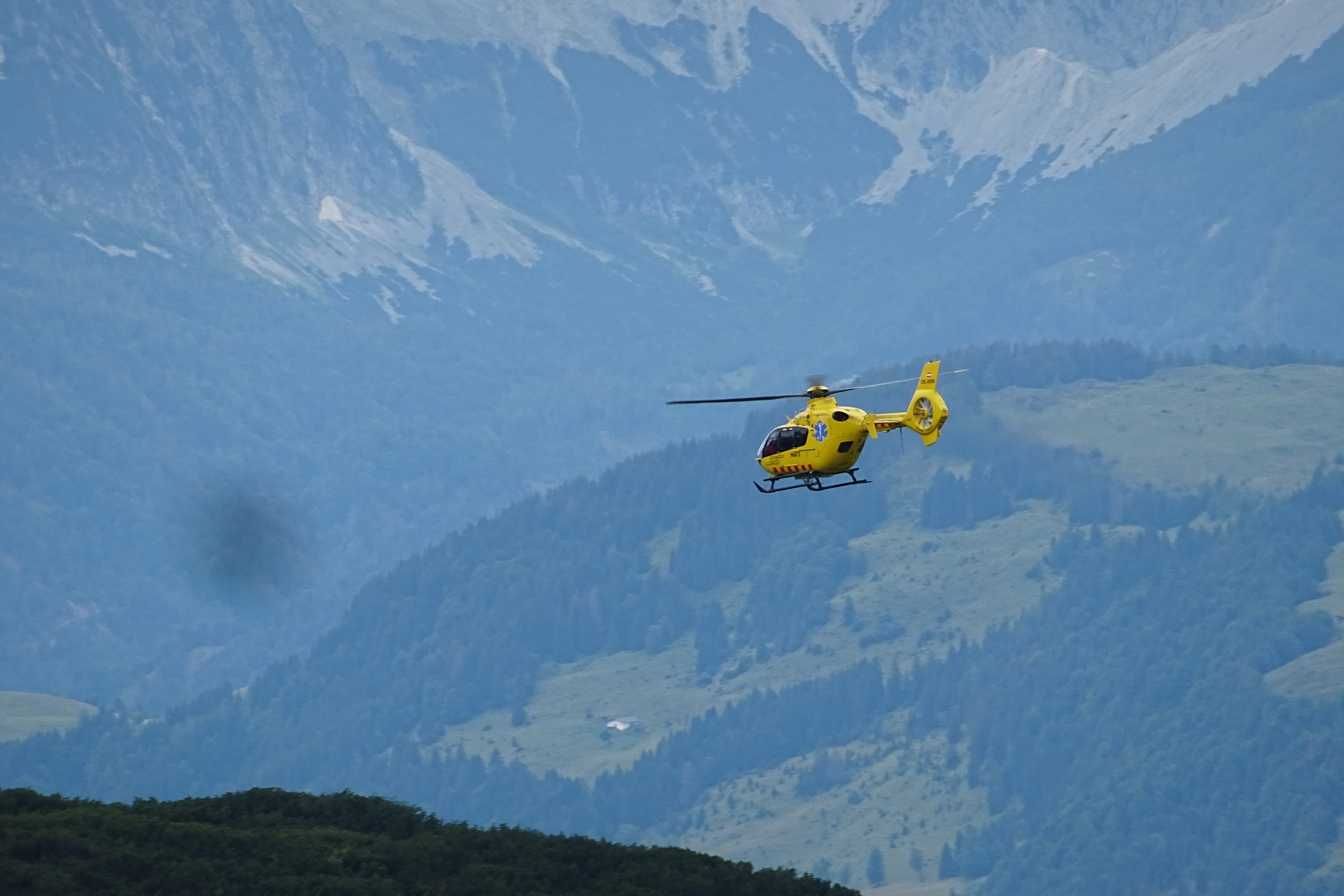 Helicopter flying over mountains
