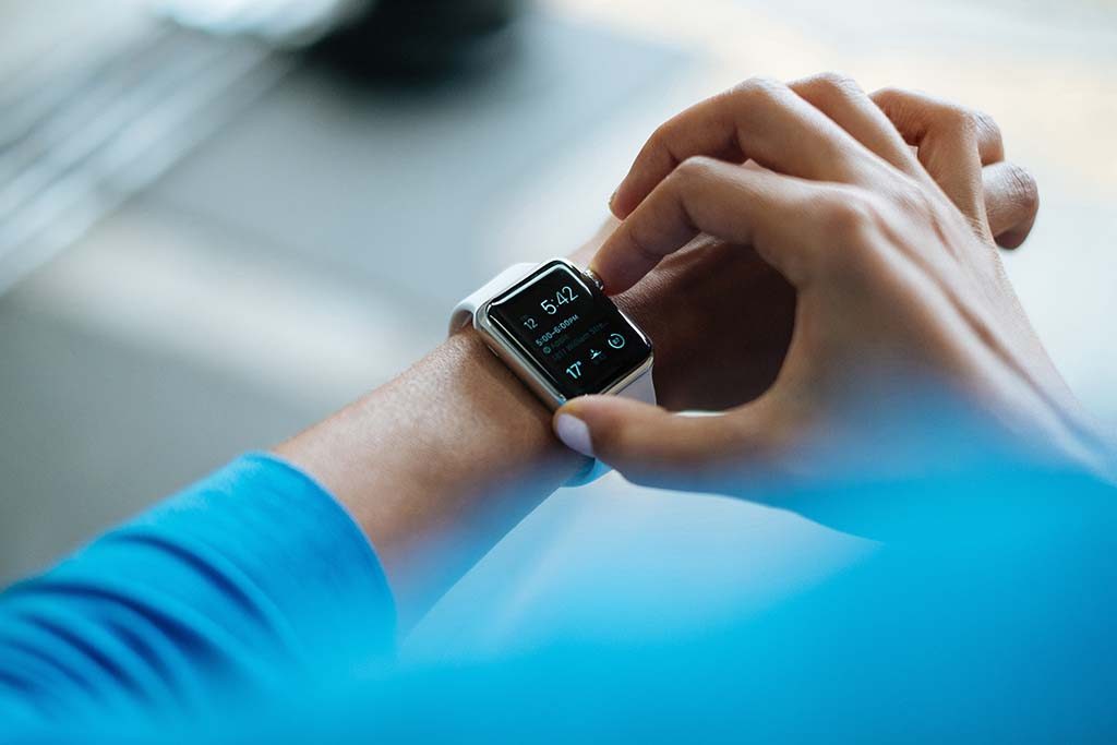 A person checking their smartwatch