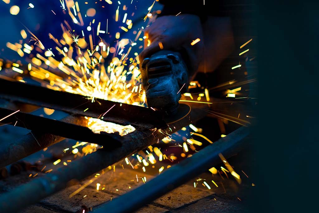 Metal grinder making sparks - contract manufacturing