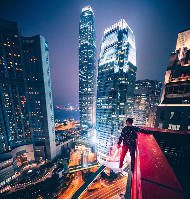 Man on ledge of building in China