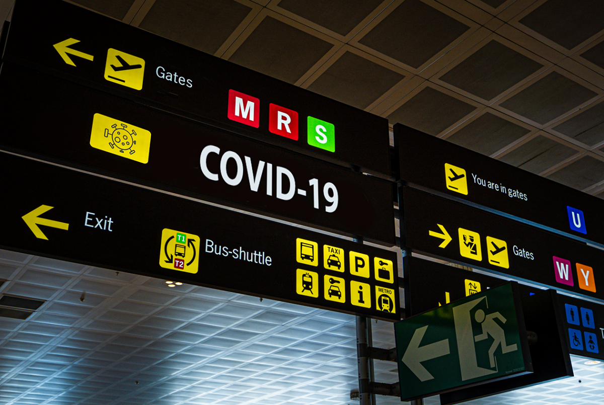 Airport sign showing COVID-19 gate