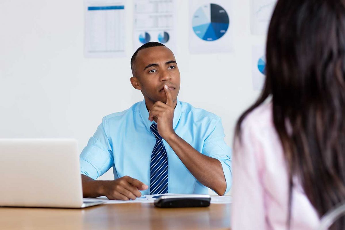 Businessman assessing colleague