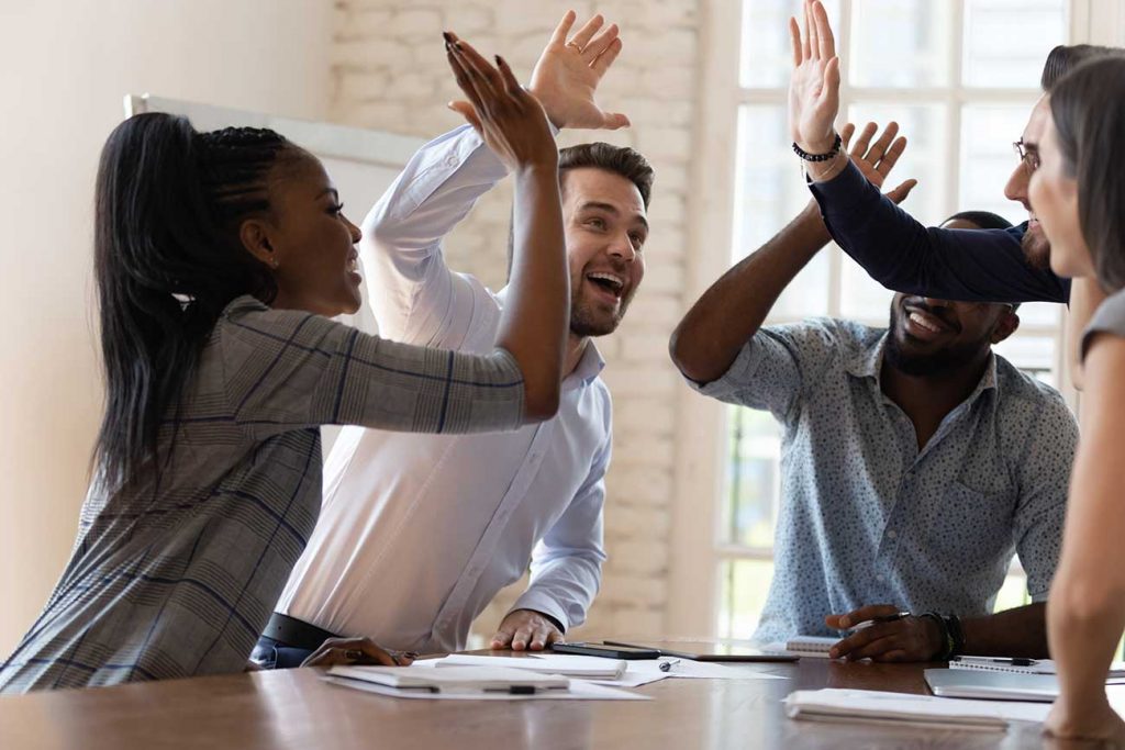 young business people high fiving