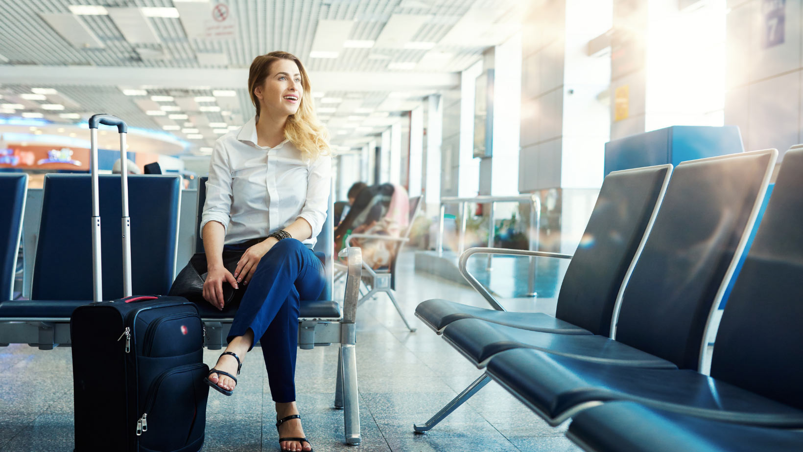 woman at airport waiting for plane