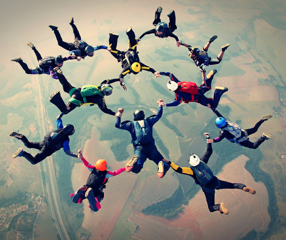 Team of skydivers working together