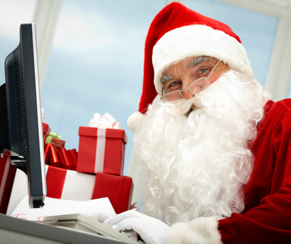 supply chain holiday 2022 - santa at a desktop computer