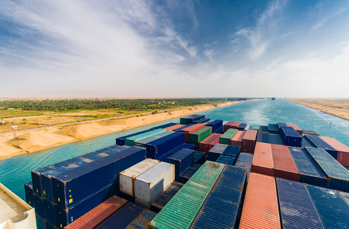Shipping containers in the Suez Canal representing a challenge to global trade growth