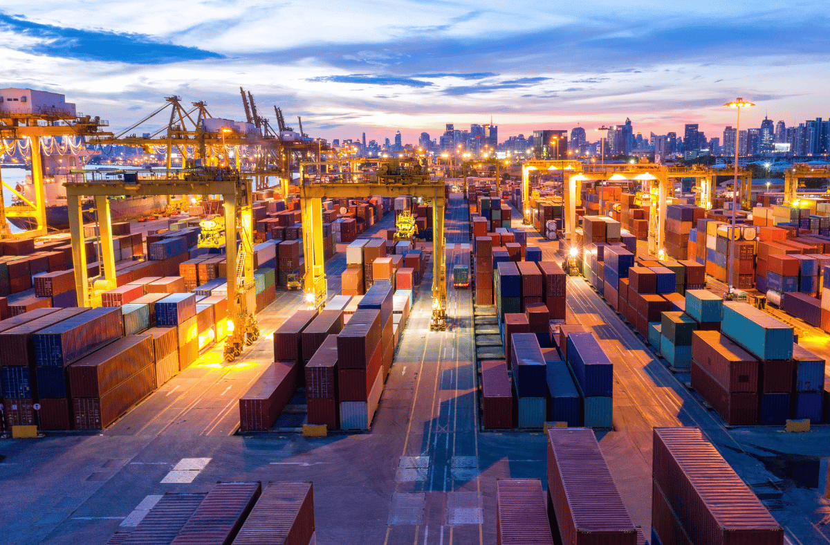 Digital Transformation of trade - shipping containers at port at sunset