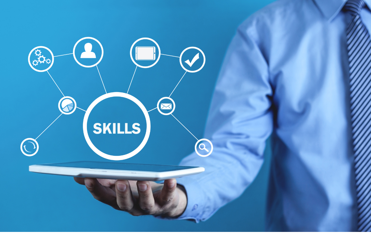 business man holding a tablet with skills icons floating above to attract AI in hiring