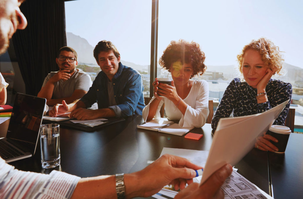 Key actions for early stage exporters - colleagues in a conference room